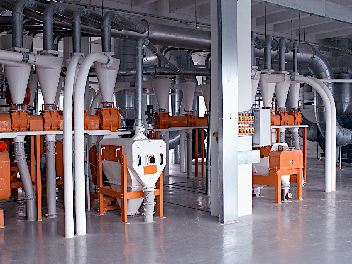 Clean Stainless Steel and Orange Equipment at Grain Processing Facility That Produces Flour