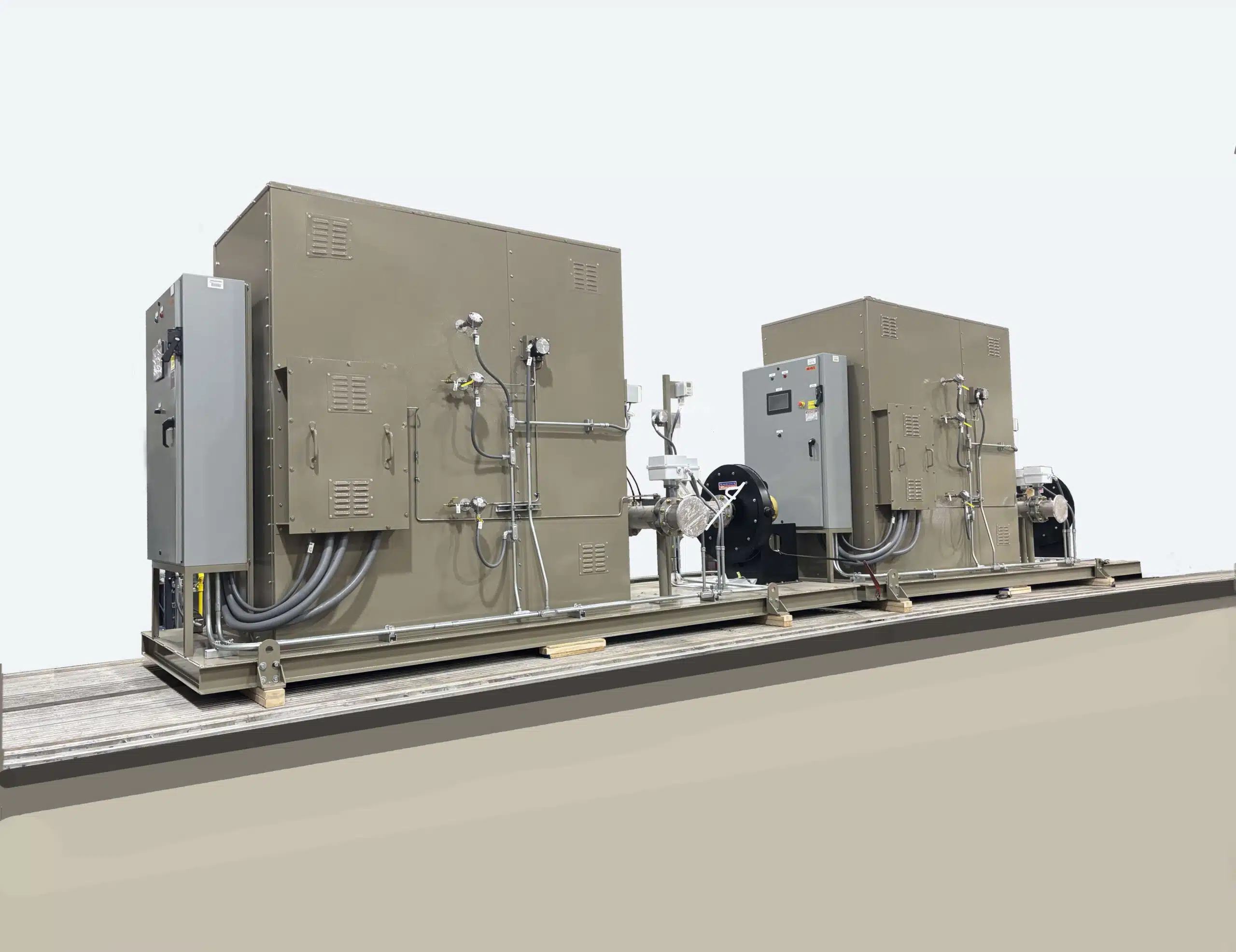 Two Electric Catalytic Oxidizers Sitting Side-by-Side Atop a Skid Waiting to be Shipped to a Semiconductor Plant