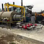 Pollution Systems OEM Horizontal Enclosed Flare, Model# HCEF-18, roof-mounted to treat VOCs at a tire recycling pyrolysis plant in North Carolina.