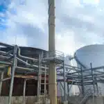 Pollution Systems OEM Vertical Vapor Combustor (Enclosed Flare) with integrated emission testing platform for NESHAP regulatory compliance.
